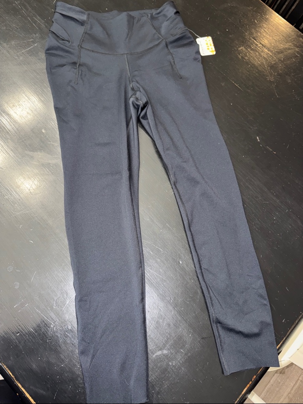 free people leggings. black. size medium. side pockets. gathered in back. NEW.